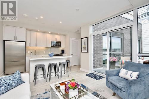 C404 - 301 Sea Ray Avenue, Innisfil, ON - Indoor Photo Showing Kitchen With Upgraded Kitchen