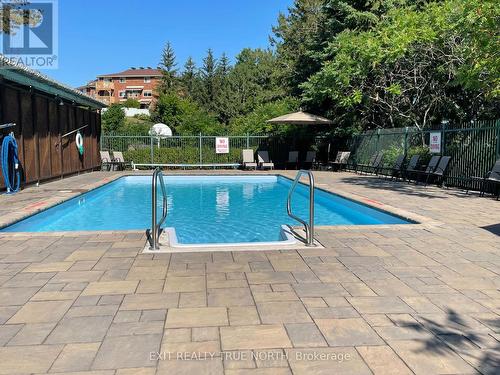 103 - 25 Meadow Lane, Barrie, ON - Outdoor With In Ground Pool With Backyard