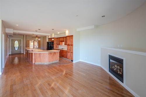 507-250 Marina Way, Penticton, BC - Indoor Photo Showing Other Room With Fireplace