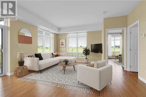 This picture has been virtually staged. - 1146 Montreal Road Unit#102, Cornwall, ON - Indoor Photo Showing Living Room