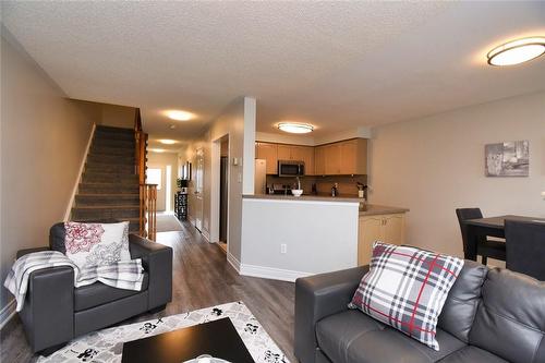 Easy access to kitchen and dining area - 5235 Thornburn Drive, Burlington, ON - Indoor Photo Showing Living Room
