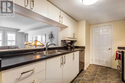 A304 - 216 Plains Road W, Burlington, ON - Indoor Photo Showing Kitchen With Double Sink