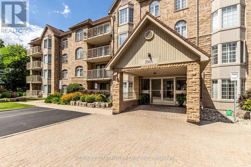 A304 - 216 Plains Road W, Burlington, ON - Outdoor With Balcony With Facade