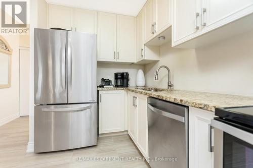 101 - 640 Sauve Street, Milton, ON - Indoor Photo Showing Kitchen With Upgraded Kitchen