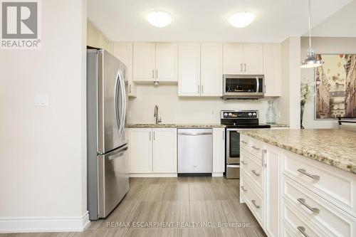 101 - 640 Sauve Street, Milton, ON - Indoor Photo Showing Kitchen With Upgraded Kitchen