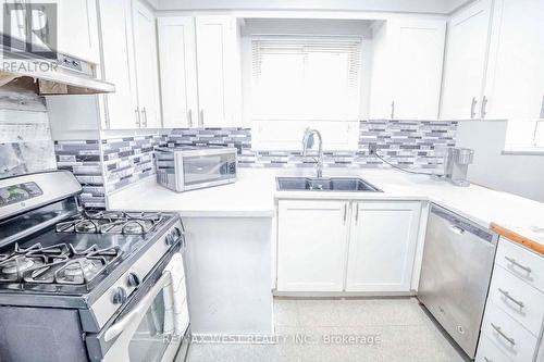 96 Cultra Square, Toronto, ON - Indoor Photo Showing Kitchen With Double Sink