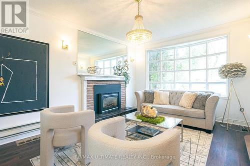 84 Glen Watford Drive, Toronto, ON - Indoor Photo Showing Living Room With Fireplace