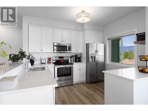 688 Lequime Road Unit# 409, Kelowna, BC - Indoor Photo Showing Kitchen With Double Sink