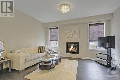 24 Sweetbay Circle, Stittsville, ON - Indoor Photo Showing Living Room With Fireplace