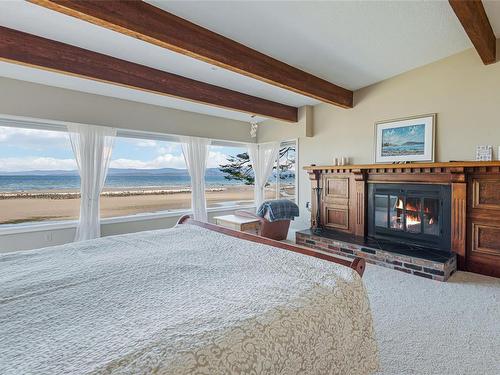 1141 Butterball Dr, Qualicum Beach, BC - Indoor Photo Showing Bedroom With Fireplace