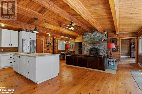 215 Crane Lake Water, The Archipelago, ON - Indoor Photo Showing Kitchen With Fireplace