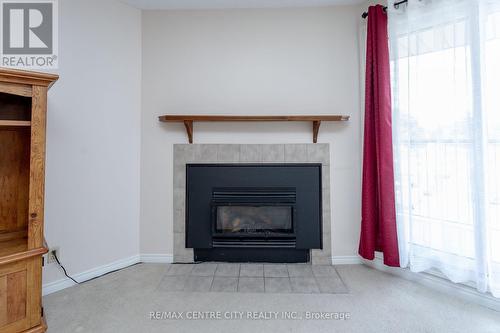 212 - 440 Wellington Street, St. Thomas, ON - Indoor Photo Showing Living Room With Fireplace