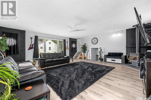 1002 Iroquois Street W, Moose Jaw, SK - Indoor Photo Showing Living Room With Fireplace