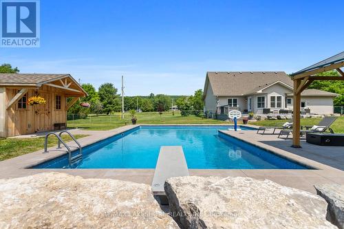9451 Hutsell Road, Hamilton Township, ON - Outdoor With In Ground Pool With Deck Patio Veranda With Backyard