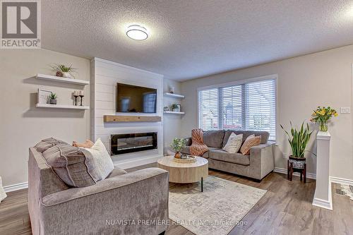 24 - 335 Lighthouse Road, London, ON - Indoor Photo Showing Living Room With Fireplace