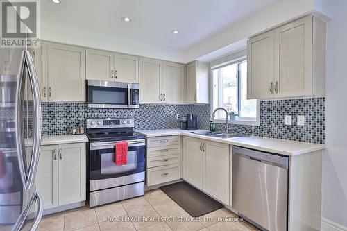 129 - 7360 Zinnia Place E, Mississauga, ON - Indoor Photo Showing Kitchen With Double Sink