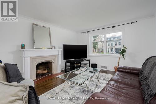 378 Prince Edward Drive N, Toronto, ON - Indoor Photo Showing Living Room With Fireplace