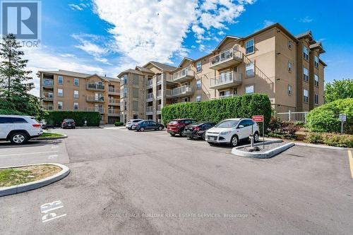 101 - 1450 Bishops Gate, Oakville, ON - Outdoor With Balcony With Facade