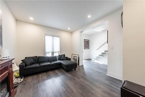 23 Baker Street, Hamilton, ON - Indoor Photo Showing Living Room With Fireplace