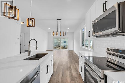 534 Taskamanwa Street, Saskatoon, SK - Indoor Photo Showing Kitchen With Stainless Steel Kitchen With Double Sink With Upgraded Kitchen