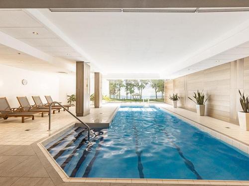 Piscine - 404-60 Rue Berlioz, Montréal (Verdun/Île-Des-Soeurs), QC - Indoor Photo Showing Other Room With In Ground Pool