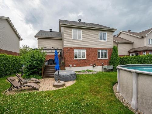 Back facade - 745 Rue Wilfrid-Pelletier, Boucherville, QC - Outdoor With Above Ground Pool With Exterior