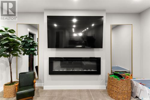 3644 Gee Crescent, Regina, SK - Indoor Photo Showing Living Room With Fireplace
