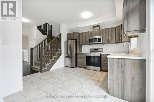 296 - 30 Times Square Boulevard, Hamilton (Stoney Creek Mountain), ON - Indoor Photo Showing Kitchen With Double Sink