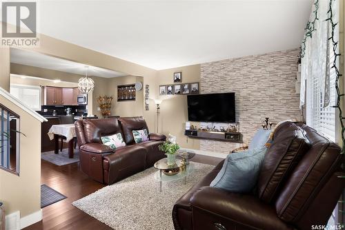 4513 Green Poplar Lane E, Regina, SK - Indoor Photo Showing Living Room With Fireplace