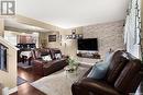 4513 Green Poplar Lane E, Regina, SK  - Indoor Photo Showing Living Room With Fireplace 