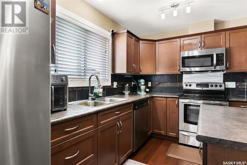 4513 Green Poplar Lane E, Regina, SK - Indoor Photo Showing Kitchen With Stainless Steel Kitchen With Double Sink