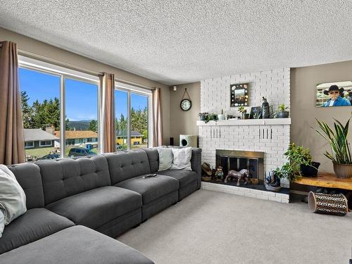 154 Aspen Cres, Logan Lake, BC - Indoor Photo Showing Living Room With Fireplace