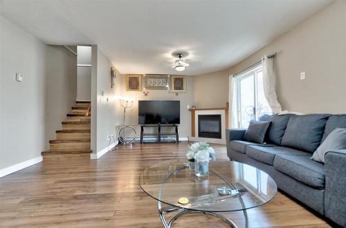 203-95 Eckhardt Avenue, Penticton, BC - Indoor Photo Showing Living Room With Fireplace