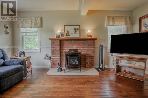 6130 3Rd Line Road, Bainsville, ON - Indoor Photo Showing Living Room With Fireplace