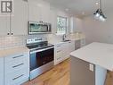 210-7440 Nootka Street, Powell River, BC  - Indoor Photo Showing Kitchen With Upgraded Kitchen 