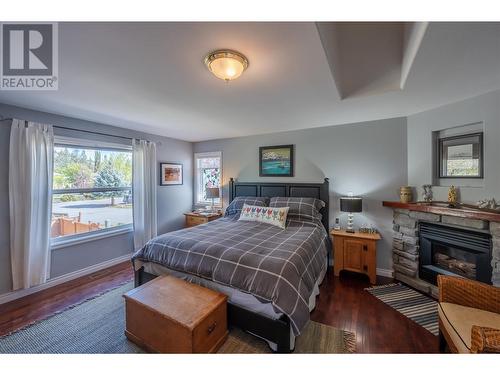 2000 Sandpiper Lane, Penticton, BC - Indoor Photo Showing Bedroom With Fireplace