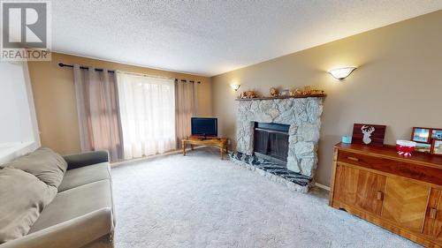 8812 87 Street, Fort St. John, BC - Indoor Photo Showing Living Room With Fireplace