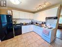 1716 Willowbrook Crescent Unit# 205, Dawson Creek, BC  - Indoor Photo Showing Kitchen With Double Sink 