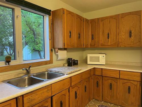 205 Athlone Street, Swan River, MB - Indoor Photo Showing Kitchen With Double Sink