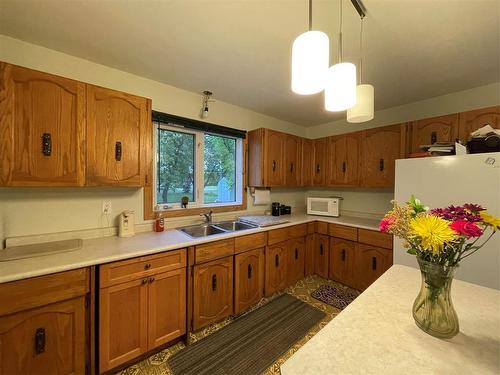 205 Athlone Street, Swan River, MB - Indoor Photo Showing Kitchen With Double Sink