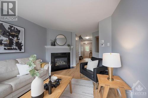 97 Bishops Mills Way, Ottawa, ON - Indoor Photo Showing Living Room With Fireplace