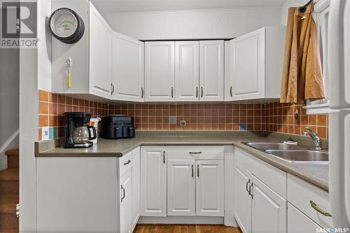 213 8Th Street E, Saskatoon, SK - Indoor Photo Showing Kitchen With Double Sink