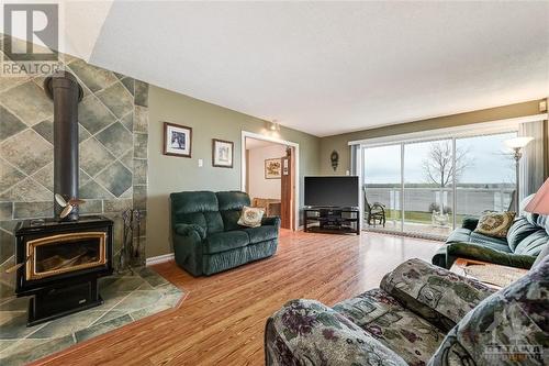 2577 Highway 174 Road, Ottawa, ON - Indoor Photo Showing Living Room With Fireplace