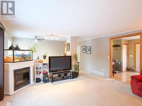 1255 Moffat Avenue, Quesnel, BC - Indoor Photo Showing Living Room With Fireplace