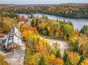 Photo aÃ©rienne - 54  - 56 Ch. D'Entrelacs, Sainte-Marguerite-Du-Lac-Masson, QC  - Outdoor With Body Of Water With View 