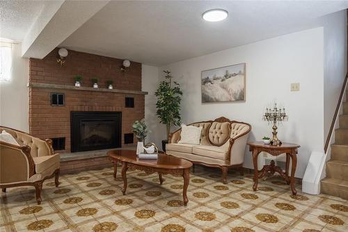 420 Barton Street E, Hamilton, ON - Indoor Photo Showing Living Room With Fireplace