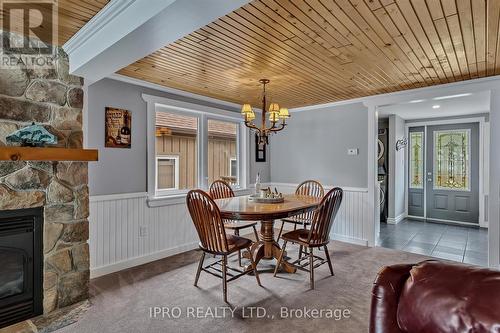 111 Crescent Drive, Kawartha Lakes, ON - Indoor Photo Showing Dining Room With Fireplace