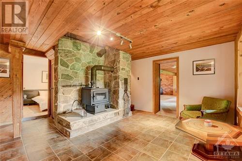 Lower level family room with a second wood stove - 2589 Calabogie Road, Calabogie, ON - Indoor With Fireplace