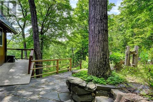 The natural landscaping is so peaceful - 2589 Calabogie Road, Calabogie, ON - Outdoor With Deck Patio Veranda