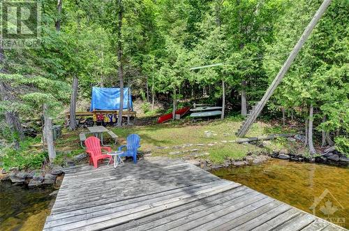 Sun and shade for everyone - 2589 Calabogie Road, Calabogie, ON - Outdoor With Body Of Water With Deck Patio Veranda